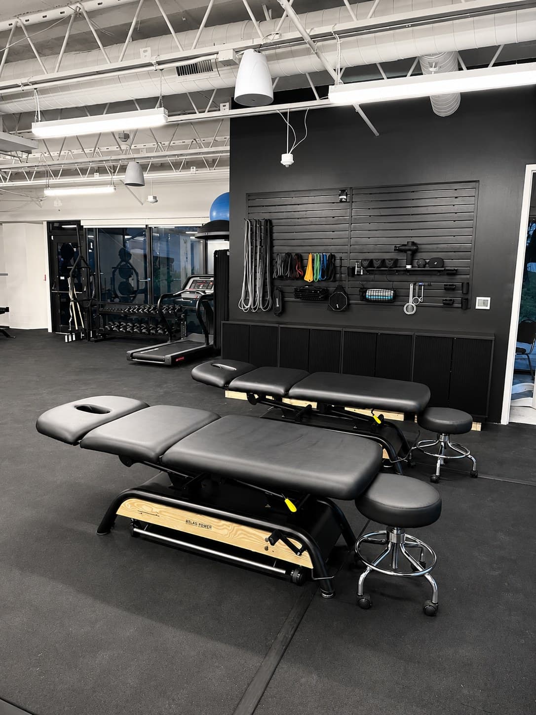 Private physical therapy treatment room with treatment table